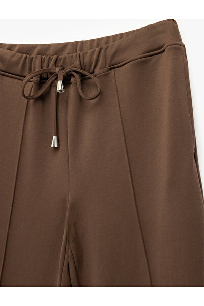 Koton Beli Bağcıklı Cepli Nervür Detaylı Modal Kumaş Düz Bol Paça Eşofman Altı