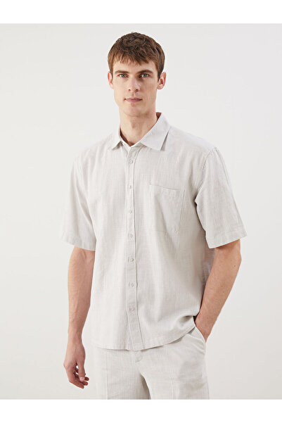 LC Waikiki قميص رجالي جديد من Özmarka للموسم الجديد بتصميم مريح وياقة منتجعات...