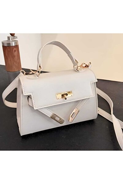 AİG Shoulder bag, an exact copy of the famous brand. It comes with a box, a bag, and a warranty card with the same brand name.