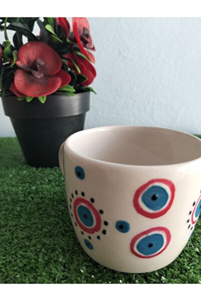 Home Coffee Cup with Red Ornament and Evil Eye Design.