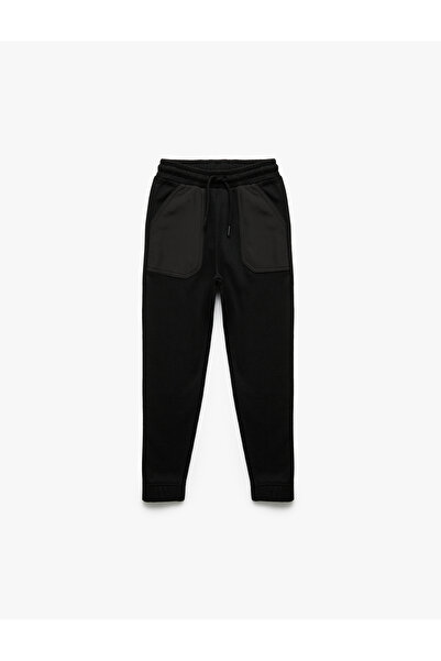 Koton Pantaloni de sport cu detaliu în buzunar, cu talie înaltă și cu șiretur...
