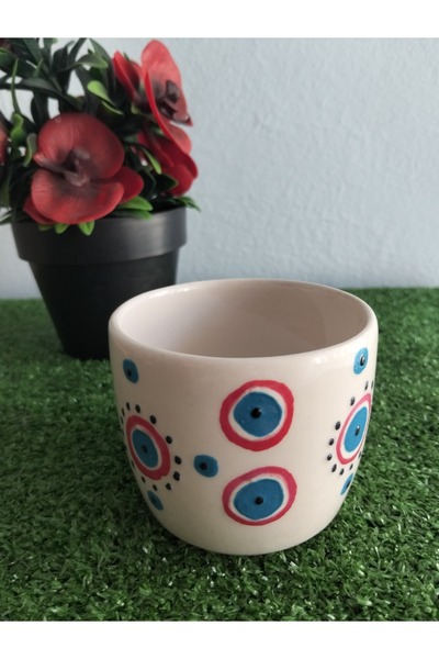 Home Coffee Cup with Red Ornament and Evil Eye Design.