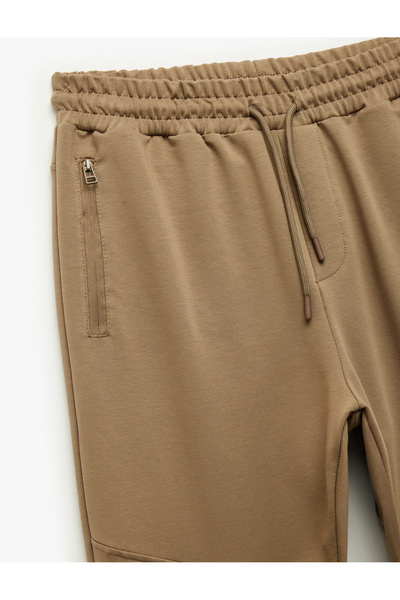 Koton Βαμβακερό παντελόνι Jogger με φερμουάρ και κορδόνια στη μέση