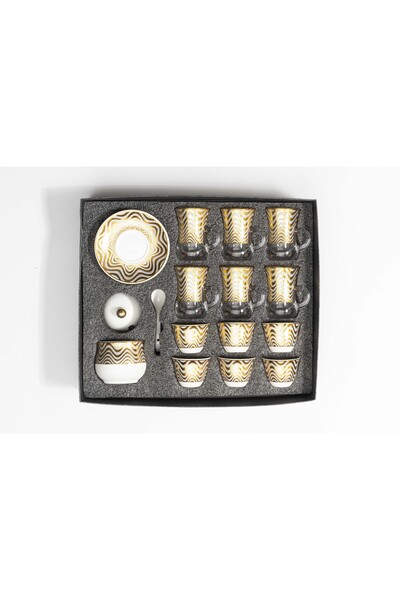 Bin Shihoun 21-piece tea and coffee serving set with a distinctive rose gold pattern