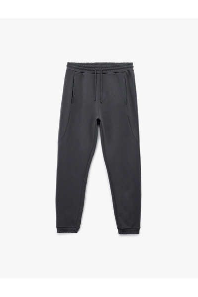 Koton Bavlněné tepláky Jogger s detailem kapsy a šněrováním v pase