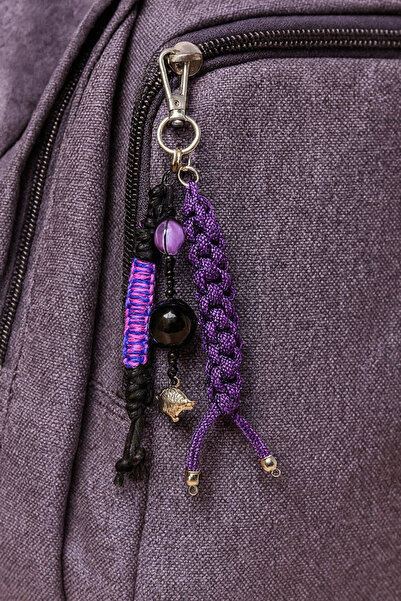 She Sells سلسلة مفاتيح على شكل حقيبة مزينة بحبل باراكورد باللونين الأرجواني و...