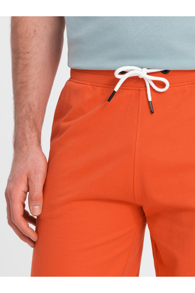 OMBRE Pánské teplákové kraťasy se zaoblenými nohavicemi - oranžové V5 OM-SRSK-0105 M