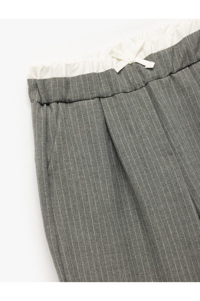 Koton Beli Lastikli Fiyonklu Viskon Karışımlı Cep Detaylı Bol Kalıp Geniş Paça Pantolon