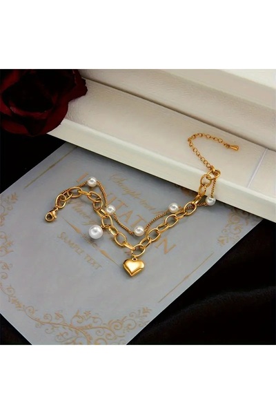 Ayzen Double-layered heart-detailed pearl bracelet.