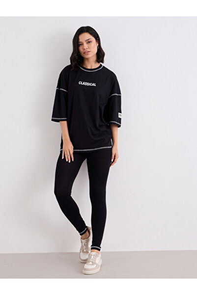 Styli Women Black Overlock Seam Oversized T-Shirt and Leggings Co-Ords