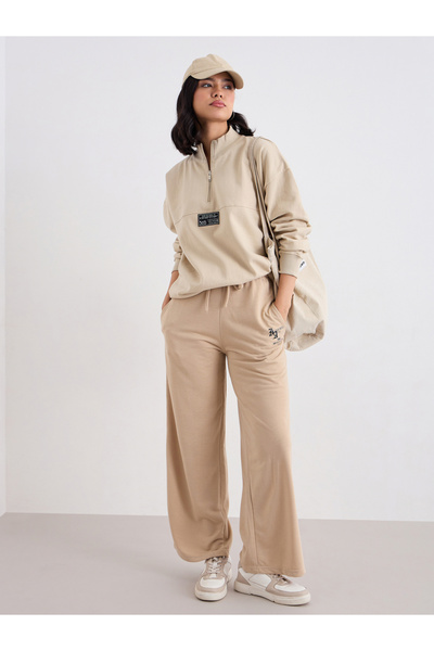 Styli Beige Longline Sweatshirt with Badge Detail