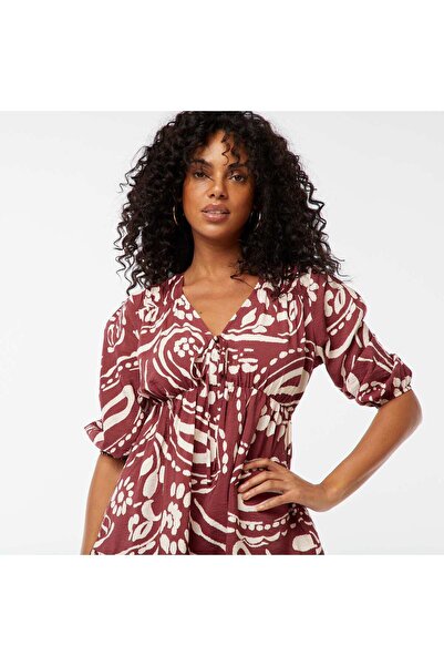 KIABI Short patterned dress with 3/4 length sleeves RED