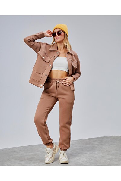 oso moda طقم رياضي بتفاصيل جيوب بزرّات كبس