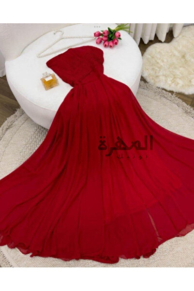 Al Mahra Boutique A fiery red evening dress with a classic and elegant cut.