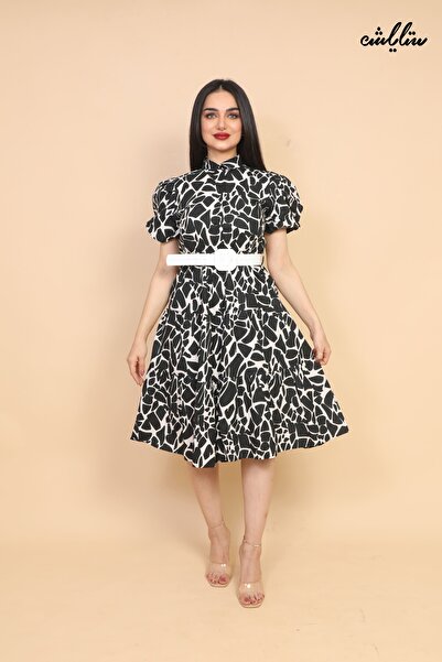 Stylish A very elegant dress with a loose cut and short sleeves, decorated wi...