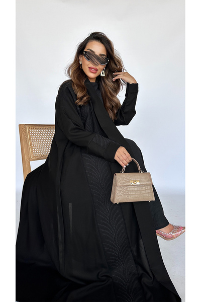 outline Black cloche abaya with black embroidery inspired by Saudi palm trees
