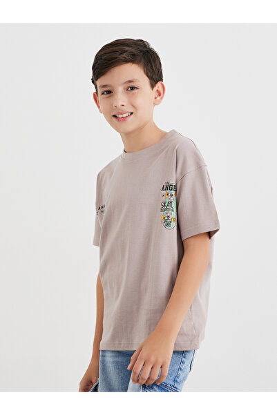 Styli تي شيرت قصة فضفاضة بطبعة جرافيكية باللون البيج للمراهقين