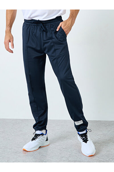 Styli Ultra Soft Slim Pintuck Athleisure Joggers with Badge Detail