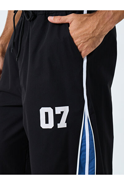 Styli Oversized Fit Cut and Sew Detail Parachute Pant