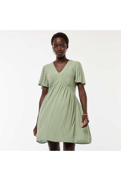 KIABI فستان قصير بأكمام قصيرة وحاشية مكشكشة باللون الأزرق