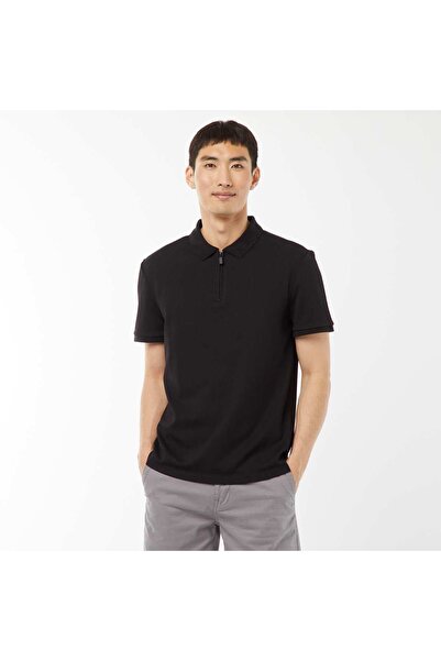 KIABI قميص بولو محبوك بنمط الوافل مع فتحة عنق بسحاب باللون الأسود