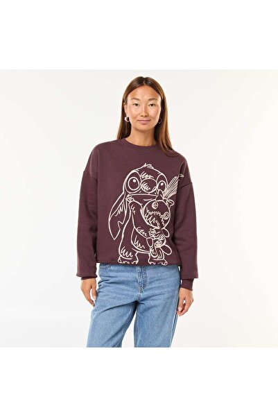 KIABI سويت شيرت بني بطبعة "ستيتش" قصة فضفاضة