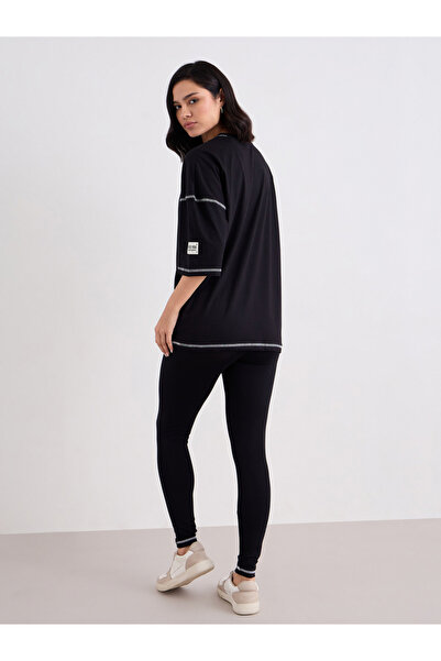 Styli Women Black Overlock Seam Oversized T-Shirt and Leggings Co-Ords