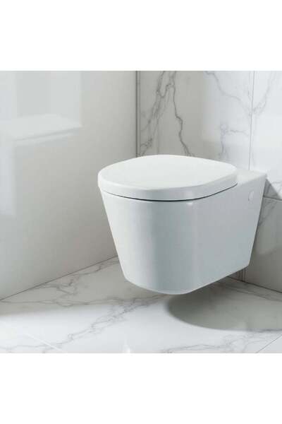 Danube Home مرحاض تونيك من Ideal Standard مُعلق على الحائط مع غطاء مقعد | تصم...