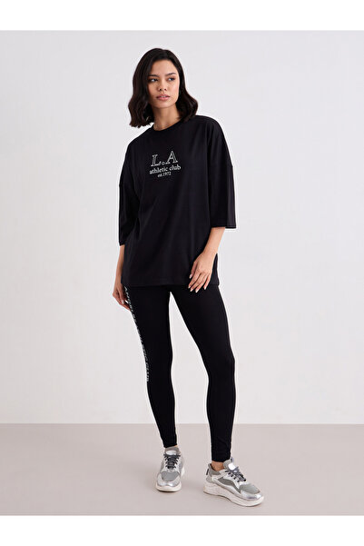 Styli Women Black Printed Oversized T-Shirt and Leggings Set