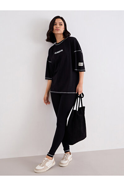 Styli Women Black Overlock Seam Oversized T-Shirt and Leggings Co-Ords