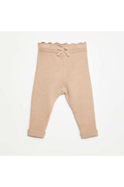 KIABI بنطال ضيق مضلع مع فيونكة مزخرفة باللون البيج