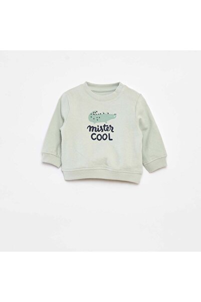 KIABI سويت شيرت بأكمام طويلة مع طباعة باللون الأخضر