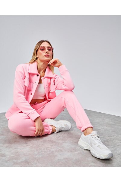 oso moda طقم رياضي بتفاصيل جيوب بزرّات كبس