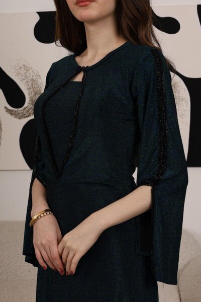 Generic Long green evening dress with luxurious sheen and wide sleeves with elegant black embroidery