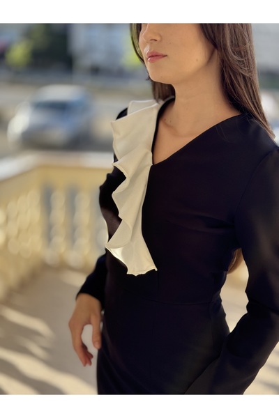 Maya Elegant midi dress, black/white with ruffles and a closed slit, suitable for special events