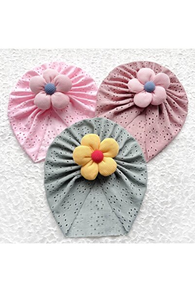 Bebelul Turban hat with openwork pattern and applied flower