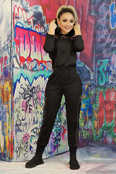 WildFashion Fashion tracksuit accessorized with patterned mesh and rhinestone...