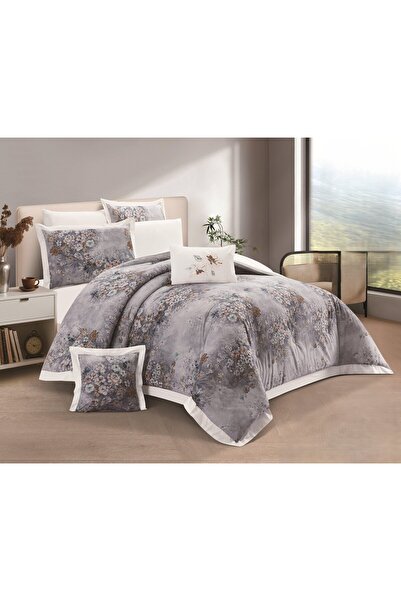 SNOOZYL A king-size bed sheet with a floral design and a cotton filling to add elegance and beauty.