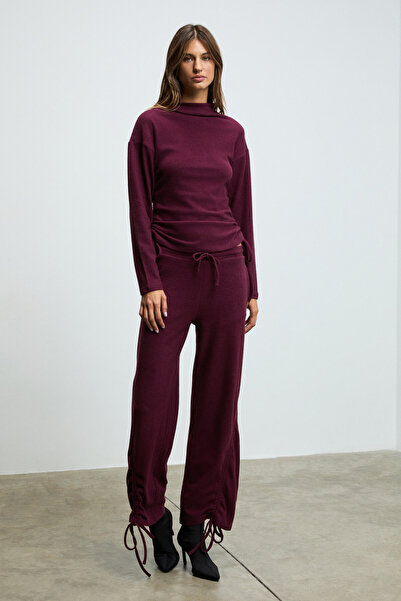 GRIMELANGE Kandias women's soft and stretchy textured burgundy sweatpants with functional side drawstrings