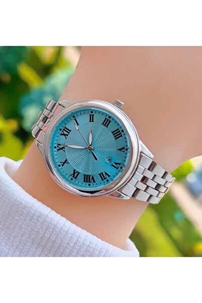 Weluxa ساعة يد نسائية باللون الفضي بأرقام رومانية صغيرة باللون الأزرق مع تقويم