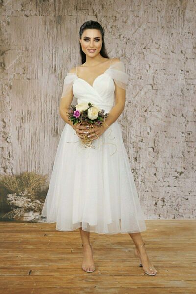 FaBe Fashion İP ASKILI DÜŞÜK KOLLU KRUVAZE YAKA BELİ BÜZGÜLÜ MİDİ BEYAZ SİMLİ...