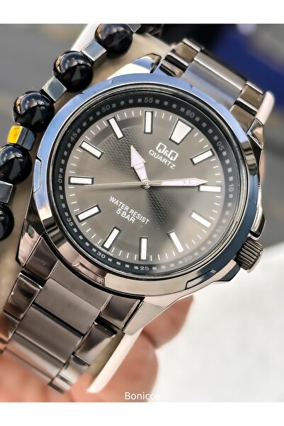 Q&Q ساعة يد رجالية، سوار فولاذي بلون سموكينج، مقاومة للماء حتى 5 ضغط جوي، مع ...