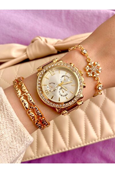 Arzu Butik ساعة يد نسائية بحزام معدني ذهبي اللون ومجموعة من الأساور