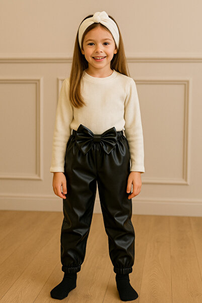 özge başaran Kız Çocuk, Siyah Deri Fiyonk Detaylı Pantolon, Krem Omuzu Fırfırlı Badi Ve Saç Bandı Takımı.