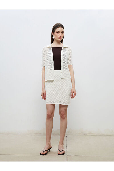 LC Waikiki تنورة تريكو صغيرة مخرمة بخصر مطاطي باللون البيج من سوليف