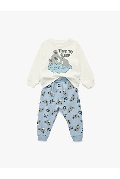 Koton طقم بيجامة قطنية مطبوعة من قطعتين من كوالا للأطفال الرضع باللون الإيكرو طقم علوي وسفلي 6Wmb10055Tk