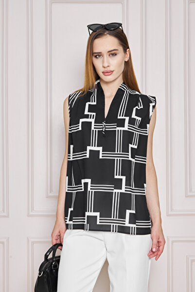 UNIQUE LADY بلوزة أنيقة بدون أكمام مع أزرار قماشية ونقوش هندسية