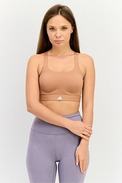 adidas حمالة صدر رياضية مبطنة بشعار العلامة التجارية للنساء، لون خوخي