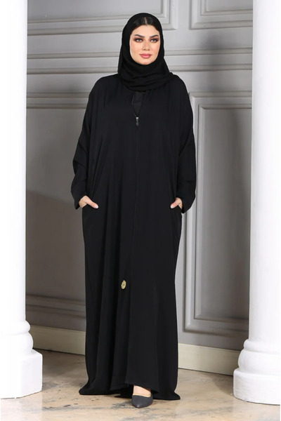 ZAHRA Black abaya with zipper and hidden pockets, woven from silk touch fabric, with a scarf