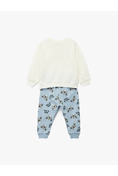 Koton طقم بيجامة قطنية مطبوعة من قطعتين من كوالا للأطفال الرضع باللون الإيكرو طقم علوي وسفلي 6Wmb10055Tk